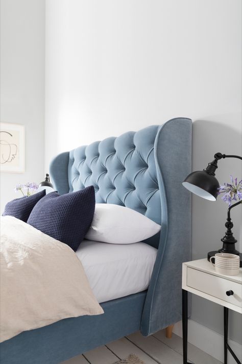 Create a luxury bedroom scheme by combining soft muted colours, elegant accessories, and a sumptuous Button & Sprung upholstered bed. Wing Back Headboard Bedrooms, Blue Bed Inspiration, Upholstery Bedroom Ideas, Powder Blue Headboard, Winged Headboard Bedroom, Light Blue Bed Frame Bedroom Ideas, Light Blue Headboard Bedroom, Blue Bed Decor, Light Blue Headboard