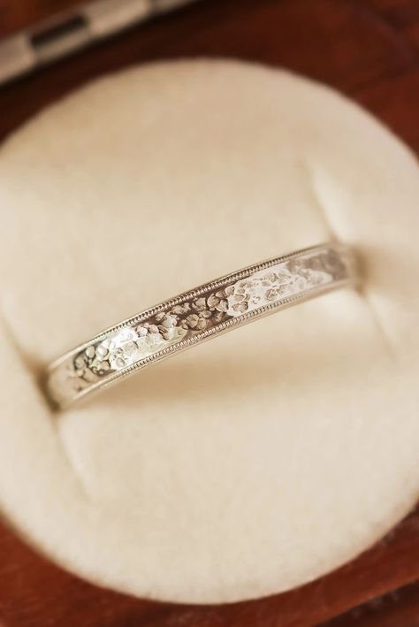 This ring style has been popular lately. It features a gorgeous but rustic hand-textured surface and bordered with a vintage inspired milgrain detail. A wedding band style like this piece is a great option if you're wanting something that has a little bit of texture and a more masculine feel, but you still want something refined and timeless. The textured surface and vintage milgrain that is then bordered by a polished smooth edge is equal parts rustic and modern. Plain Gold Wedding Bands, Gold Wedding Band Women, Solid Gold Wedding Band, Wide Wedding Rings, Filigree Wedding Ring, Word Ring, Gold Wedding Bands Women, Wedding Band Vintage, Wedding Band Styles