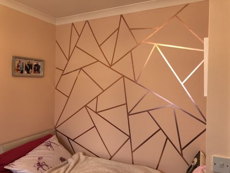 Rose gold washi tape to create a feature wall, two and half rolls of 10 meter long tape used Bedroom With Rose Gold Accents, Wall Taping Design, Geometric Wall Tape Design, Gold Tape Wall Design Bedroom, Washi Wall Art, Gold Washi Tape Wall, Girl Bedroom Walls Paint, Wall Painting With Tape Design, Rose Gold Accent Wall