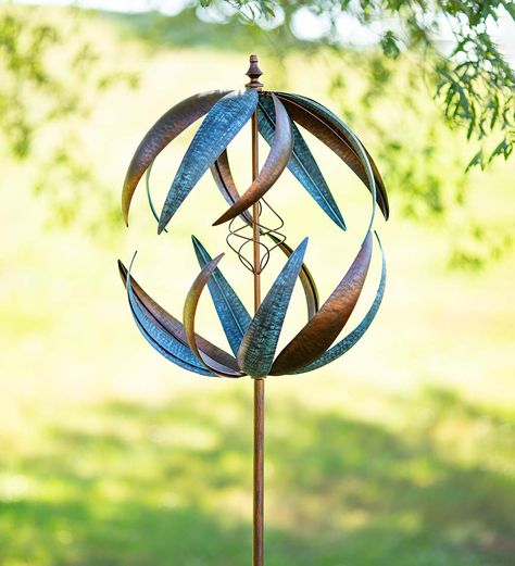 This handsome Metal Dual Swirl Wind Spinner features two sets of spiraling arms that turn independently in the breeze. The bronze-colored and patina-like finishes add a sense of elegance. Standing seven feet tall with a 21" diameter, this spinner will not go unnoticed. The two horizontal-spinning rotors turn in even a gentle breeze. There's even a wire spiral at the center. A sturdy metal pole supports the spinner and installs securely in your garden thanks to sturdy metal stake Kinetic Wind Spinners, Garden Wind Spinners, Garden Spinners, Wire Spiral, Metal Wind Spinners, Wind Sculptures, Metal Pole, Kinetic Sculpture, Garden Accents