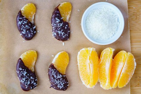 Make these Chocolate Orange Cuties with YOUR Cuties! - Something sweet to make with YOUR little cuties! And super healthy too :) Ingredients: 4-6 small oranges/mandarins 1 cup high quality dark chocolate 1 Tbsp coconut oil 1-2 Tbsps unsweetened dried coconut (I prefer " Let's do Organic" brand) Instructions: Peel the oranges and separate into... Healthy Kids Party Food, Low Sugar Snacks, Desiccated Coconut, Slow Cooker Desserts, Healthy Christmas, Fussy Eaters, Holiday Snacks, Kids Party Food, Easy Meals For Kids