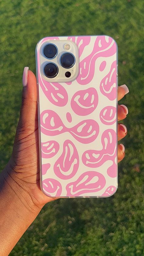 This stylish, pastel pink phone case features a groovy, dripping melting smiley face design in white and pink. Constructed from TPU, it provides a soft yet durable protective layer for your device. Smiley Phone Case, Preppy Iphone Case, Phone Cases Aesthetic, Preppy Phone, Ideas Emprendimiento, Clear Phone Case Design, Phone Case Ideas, Preppy Phone Case, Pink Phone Case