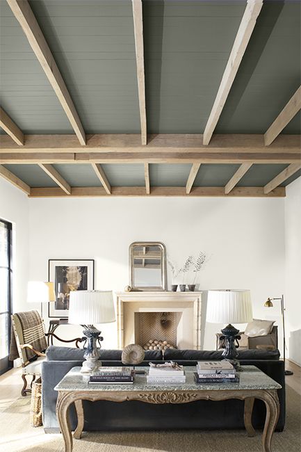 A modern neutral palette living room with high wood panelled ceiling painted in a dramatic gray. Dark Gray Paint, Painted Wood Ceiling, Trashy Y2k Bedroom, Painted Ceiling Beams, Dark Gray Paint Colors, White Ceiling Paint, Painted Beams, Ceiling Paint Colors, Y2k Bedroom