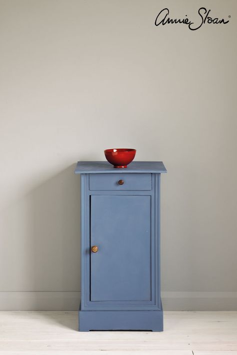 Vintage classic upcycled side table painted with Chalk Paint® by Annie Sloan in Greek Blue, a Mediterranean blue. Set against a pastel grey wall of Paris Grey with white washed floorboards. Curtain and lampshade made from Annie's fabric Piano in Olive, a fun illustrated linen with earthy colours from the Chalk Paint® palette. Decorative Furniture Painting, Greek Ideas, Annie Sloan Chalk Paint Colors, Blue Side Table, Blue Grey Walls, Chalk Paint Wax, Gray Painted Walls, Blue Chalk Paint, Dark Blue Walls