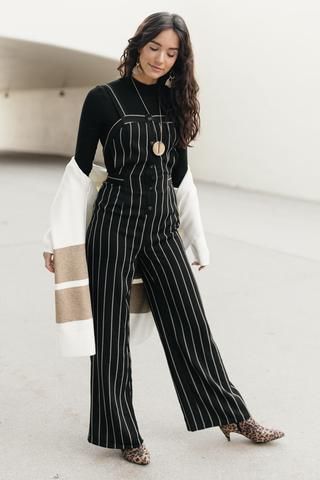 This jumpsuit features a black and white pinstripe pattern, tank straps that go into a... Pinstripe Jumpsuit, Pinstripe Pattern, High Quality Clothing, Denim Blouse, Vintage Paris, Roaring Twenties, Work Clothes, Turtle Neck Top, Wide Pants