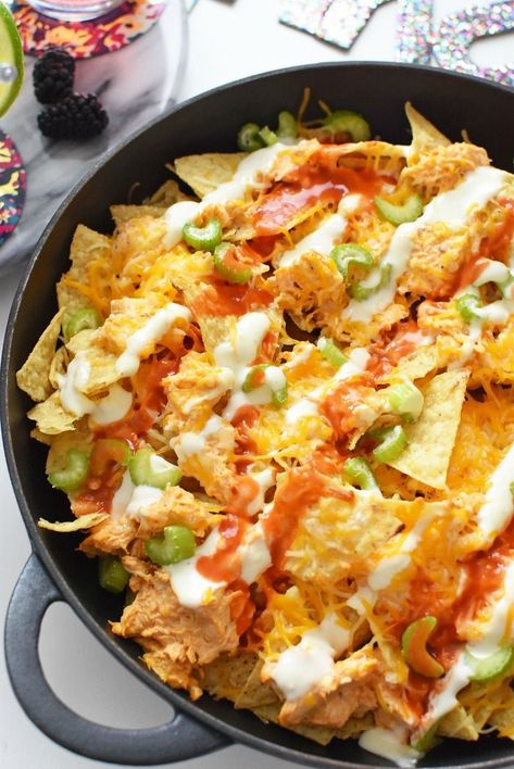 Ultimate Buffalo Chicken Nachos are the perfect game day recipe. Every cheesy, crispy, crunchy bite is total perfection. This crowd-pleasing appetizer is ideal for game days or parties. Make these cheesy chicken nachos to curb your buffalo chicken loving cravings today! #nachos #appetizers #gameday #buffalochicken  via @savvysavingcoup Buffalo Chicken Nachos Recipe, Buffalo Chicken Nachos, Chicken Nachos Recipe, Nachos Recipe Easy, Easy Buffalo Chicken, Crowd Pleasing Appetizers, Game Day Appetizers, Chicken Nachos, Chicken Dips