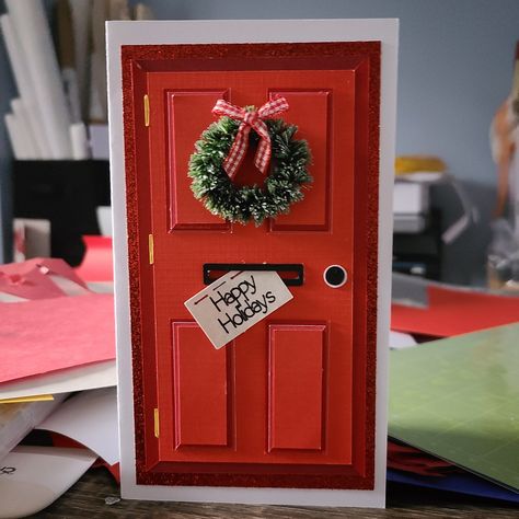 "Handmade greeting card, perfect for the holidays. Front features a glitter red door with mock mail slot and wreath. Card is blank inside. Classic, layered, 3D design for Christmas. Card measures approximately 4\" x 7\" (10.16cm x 17.78cm). Comes with 5 x 7 brown kraft envelope. The card is made with a \"Christmas Red\" door by default, but can be made with a green door, blue door, etc. Please specify preferences or other special instructions in the Personalization field if needed. ** Please not Christmas Card Scrapbook, Front Door Christmas Card, Red Christmas Cards Handmade, Christmas Door Card, Christmas 3d Cards, Door Cards Handmade, Christmas Card Scrapbooking, Christmas Cards Pop Up, Christmas Cards Ideas Handmade