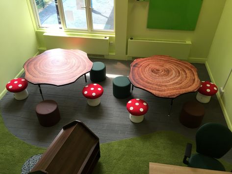 modern woodland themed primary school classroom with tree trunk tables and mushroom chairs Diy Mushroom Chair, Woodland Themed Room, Classroom Woodland Theme, Cottagecore Classroom Theme, Mushroom Classroom Decoration, Cottagecore Classroom Decor, Garden Theme Classroom Decorations, Mushroom Classroom Theme, Mushroom Themed Room