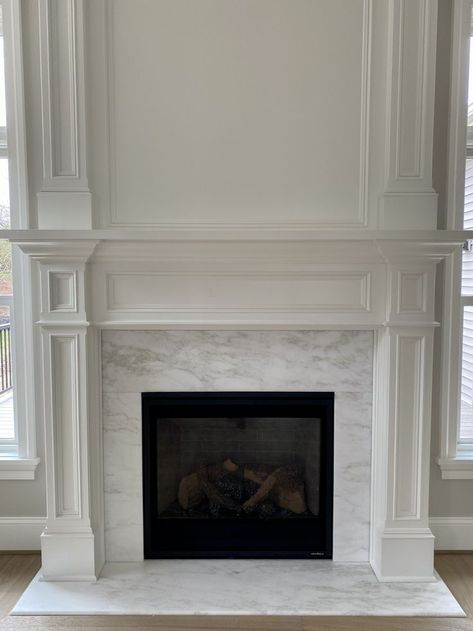 Wood Mantle Marble Fireplace, White Granite Fireplace, Quartz Around Fireplace, Traditional Marble Fireplace, Marble Tile Around Fireplace, Fireplace With Marble Tile, Marble Hearth Fireplace, Calcutta Marble Fireplace, Fireplace Makeover High Ceiling