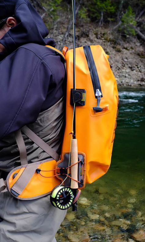 This photo shows a fly fisher wearing a Fishpond Thunderhead Submersible Backpack with the Fishpond Quickshot Rod Holder accessory attached with a fly rod. Dry Backpack, Kayak Fishing Diy, Fly Fishing Accessories, Fishing Backpack, Fishing Bag, Fly Fishing Tips, Fly Fishing Gear, Fly Fishing Rods, Walleye Fishing