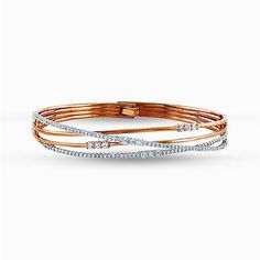 Featuring a distinctive contemporary design, this twist style bracelet is accentuated with 1.51 ctw of shimmering white diamonds in a dazzling white and rose gold setting. Available at GMG Jewellers. Rose Gold Diamond Bracelet, Diamond Bracelet Design, Diamond Necklace Designs, Rose Gold Bangle, Diamond Bangles Bracelet, Bangles Jewelry Designs, Diamond Jewelry Designs, Bracelets Gold Diamond, Gold Bangles Design