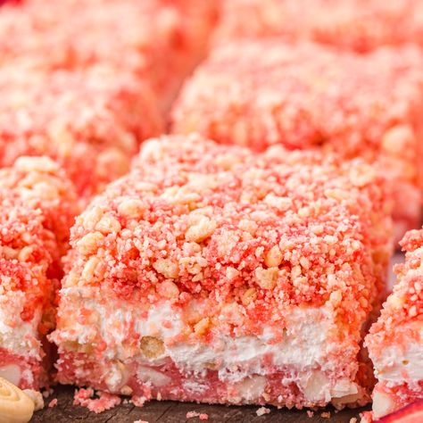 These stunning Strawberry Crunch Brownies are a layered delight full of fruity flavor, white chocolate, and sweet creaminess. They’re topped with an Oreo and strawberry-flavored crumble. Best of all, these brownie bars are so simple to make! If you love strawberry ice cream crunch bars, you’ll adore this Strawberry Crunch Brownie recipe! All the flavors and textures are right here but in brownie bar form. They’re great for summer events, holidays, birthday parties, graduations, baby showers,... Strawberry Crunch Brownies, Ice Cream Crunch, Crunch Brownies, Brownie Bars, Strawberry Brownies, Strawberry Crunch, Crunch Bars, Crunch Bar, Chocolate Crunch