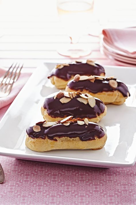 Show up at a party with these chocolate-dipped Éclairs with Almond Pastry Cream, then listen to the oohs and aahs! They only look fancy — they're actually quite simple to prepare with the help of pâte à choux, a thick and sticky pastry dough is typically made from just four ingredients. Eclair Chocolate, Pastry Cream Desserts, Chocolate Tres Leches Cake, Pastry Cream Recipe, Eclair Recipe, Almond Pastry, French Desserts, Pastry Cream, Cream Desserts