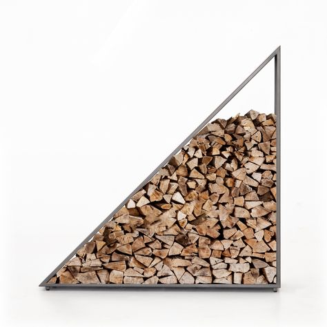 Store firewood in style. An large-scale open triangle of gunmetal-coated iron stands tall and sturdy, awaiting chopped wood for open display, indoors or out. Cover or store inside during inclement weather. Dimensions: 48"w x 12"d x 48"h Collection: Element Colors: Coated Gunmetal Materials: Iron Weight: 48 lb *This item is excluded from sale events and not available for additional discounting or promotional offers. Firewood Ideas, Store Firewood, Firewood Stand, Diy Rack, Basement Fireplace, Firewood Holder, Fireplace Logs, Office Storage Furniture, Firewood Rack