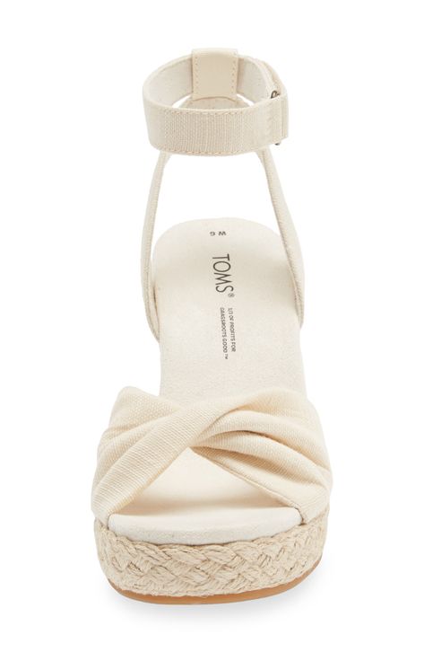 An espadrille-style platform wedge brings earthy texture and stylish height to a warm-weather sandal finished with a twisted toe strap. 3 1/2" heel; 3/4" platform (size 8.5)   3 1/2" strap height   Adjustable ankle strap with hook-and-loop closure   OrthoLite® Eco LT Hybrid insole   TOMS gives a minimum of one-third of its annual net profits to support grassroots efforts, partnering with organizations that boost mental health, increase access to opportunity and end gun violence   TOMS is a Certified B Corporation, which meets standards for verified social and environmental performance, public transparency and legal accountability to create a more inclusive and sustainable economy Costal Grandma Shoes, Cute Wedge Heels, Hoco Shoes, Sandals Aesthetic, Espadrilles Style, Cute Wedges, Summer Wedges, Sandals Platform, Summer Heels