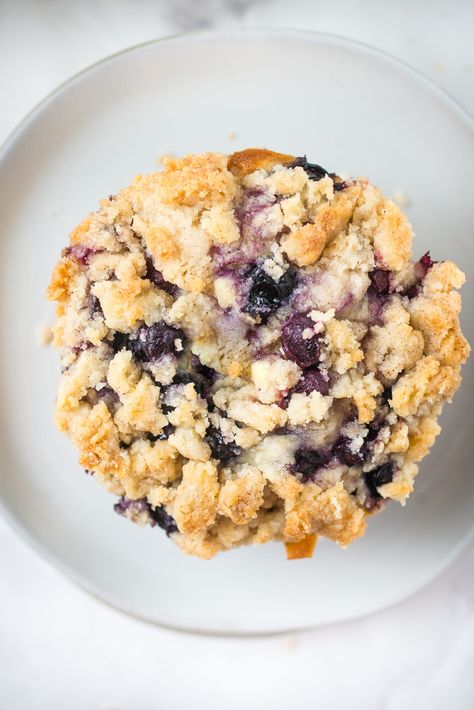 Buttermilk Blueberry Muffins are the perfect way to start your day! Every bite is bursting with blueberry flavor and a mouthwatering cinnamon streusel topping! #buttermilkblueberrymuffins #blueberrymuffins #breakfastrecipes #brunchrecipes #blueberryrecipes #muffinrecipes #blueberries #blueberrymuffinrecipewithbuttermilk #easyrecipes #familyfriendlyrecipes #buttermilkblueberrymuffinswithstreuseltopping Blueberry Buttermilk Recipes, Blueberry Muffins With Streusel Topping, Blueberry Buttermilk Muffins, Maine Blueberries, Banana Chocolate Chip Bars, Basic Cupcake Recipe, Blueberry Crumble Muffins, Buttermilk Blueberry Muffins, Buttermilk Recipe