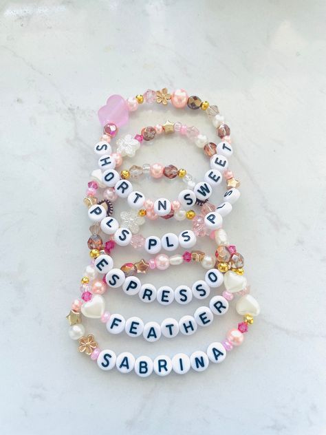 5 pack of Sabrina bracelets Size: 6.5-7in Short And Sweet Bracelet, Short N Sweet Bracelet, Sabrina Carpenter Bracelet Ideas, Sabrina Carpenter Bracelets, Sabrina Bracelet, Bracelet Sayings, Apple Watch Bands Fashion, Diy Kandi, Bracelet Inspo