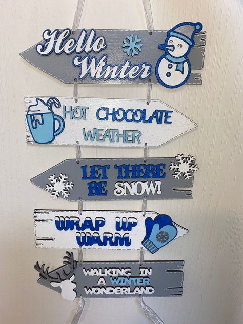 Christmas winter theme direction arrow sign post. Hand painted Any colour theme available Size: Each individual Arrow is Approx * 195mm Width x 60mm Height *19.5 cm Width x 6cm Height Christmas Signpost, Winter Wonderland Christmas Theme, Christmas Winter Wonderland Theme, Hanging Angel Wings, Direction Arrow, Wonderland Decorations, Snow Signs, Laser Cut Christmas, Winter Wonderland Decorations