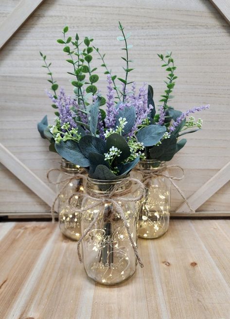 lavender eucalyptus wedding - Google Search Lavender And Bronze Wedding, Lilac Mason Jar Centerpieces, Lavender Flowers For Wedding, Lavender In Mason Jars, Plum And Eucalyptus Wedding, Lilac Eucalyptus Wedding, Cottagecore Wedding Table Decor, Lavender Center Piece Wedding, Pretty Centerpiece Ideas