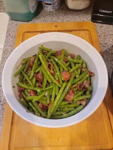 Firehouse Green Beans Add a kick to your sides with these Firehouse Green Beans! Packed with bacon and a smoky sweetness, they're sure to be a hit at any meal. 🔥🌱 Ingredients: 2 pounds fresh green beans, trimmed 8 slices bacon, chopped 1/2 cup brown sugar 2 cloves garlic, minced 1/4 cup butter 1/2 teaspoon red pepper flakes Salt and pepper to taste Directions: In a large skillet, cook the bacon over medium heat until crisp. Remove the bacon with a slotted spoon and set aside on a paper to... Slotted Spoon, Salt Flakes, Fresh Green Beans, Vegetable Sides, Red Pepper Flakes, Fresh Green, Red Pepper, Quick Meals, Green Beans