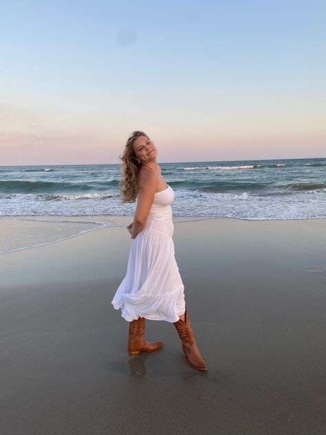 Sunset beach pictures, cowboy boots, brown boots, beach pic inspo, sunset photos, white long skirt, monochrome outfit, beach photos, coastal cowboy coastal cowgirl, brown boots, natural hair, curly hair Cowgirl Beach, Coastal Cowboy, Beach 2023, Cowgirl Skirt, Beach Pic Inspo, Cowboy Boots Brown, Graduation Pics, Beach Pic, White Long Skirt