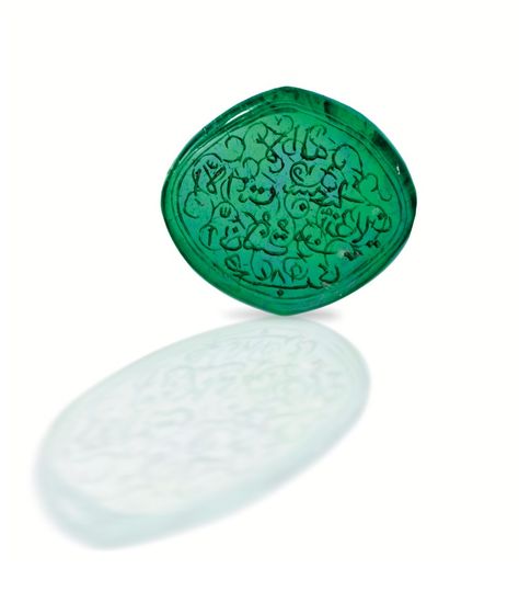 Carved Emerald Taviz, 19th Century, weighing 30.44 carats, measuring approximately 31.58 by 26.86 by 4.80 mm., the back engraved with an Arabic inscription from Chapter XXI, verse 87 of the Koran which, according to one translation, reads: 'There is no God but thou: I was indeed wrong!', the front engraved with a foliate motif, drilled at either end. #antique #Taviz #gem Islamic Antiques, Carved Emerald, Carved Gemstones, Ruby And Diamond Necklace, Islamic Jewelry, Diamond Picture, 5 Elements, Antique Jewelry Indian, Ancient Artifacts