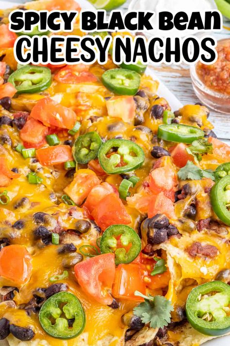 Nachos are a classic snack for just about any occasion – especially if they’re topped with melted cheese and spicy beans! And when you use your oven to bake them on a sheet pan, you have a delicious snack that’s also easy to prepare. That’s why this recipe for spicy black bean nachos is sure to be a hit at any get-together. Everyone will love the crispy chips topped with cheese and a spicy bean mixture, making it perfect for a party. Black Bean Nachos Recipe, Nachos Recipe Oven Baked, Healthy Sheet Pan Nachos, Oven Nachos Recipes, Beans For Nachos, Bean And Cheese Nachos, Nachos Recipe Vegetarian, Meatless Nachos, Bean Nachos Recipe