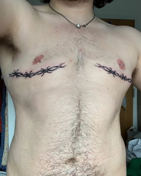 Trans Scar Tattoos on Instagram: “Here is @whack.k with sick piercings and ink over the scars! 🖤 Submit your own trans surgery scar tattoo cover ups/incorporation by DM to…” Trans Men Tattoo Ideas, Trans Men Chest Tattoos, Trans Guy Tattoo, Top Sergury Scar Tattoos, Top Surgery Scar Tatoos, Trans Top Surgery Art, Tattoo Ideas Top Surgery, Pelvis Tattoos Men, Top Surgery Ftm Plus Size