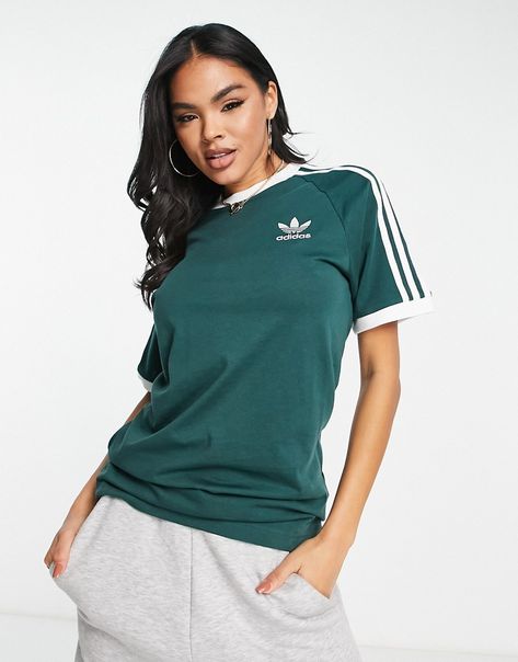 Tops by adidas Originals The ultimate all-rounder Crew neck Short sleeves adidas logo details Boyfriend fit Green Adidas Outfit, Green Tee Outfit, Stripe Tee Outfit, Adidas Shirt Outfit, Adidas Originals Outfit, Adidas Adicolor, Football Tops, Adidas Classic, Adidas Tee