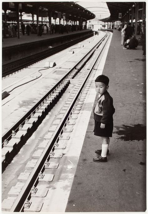 [Child close to the tracks at the train station, Tokyo, Japan] Robert Capa Photography, Japanese Warehouse, Gerda Taro, Old Japan, Photography Monochrome, Tokyo Station, Robert Doisneau, Henri Cartier Bresson, Adventure Photographer