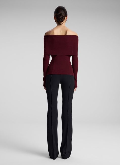 The Evelyn Top is crafted from stretch merino wool in a burgundy hue. This off-the-shoulder silhouette features a wide foldover detail that hits at the elbows and knuckle-grazing sleeves. Shop Tops, Styling Tip: Layer over a fluid skirt and slingback heels for an evening out. Casual And Professional Outfits, Christmas Clothes For Women, Off The Shoulder Top Sweater, Cute Office Clothes, Petite Elegant Style, Chic Fall Tops, Red And Black Outfits For Women Classy, Wine Red Clothes, Elegant Everyday Outfits