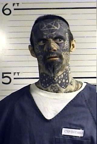 On one hand, the bow tie makes him look... umm, conflicted. I'm going with conflicted. Bow tie guy by day, scary ass satanist by night. Haha, I'm really wondering his thought process for having a bow tie tat. Bow Tie Tattoo, Satanic Star, Funny Mugshots, Terrible Tattoos, Mug Shot, Tattoo Fails, Bad Tattoos, Face Tattoos, Weird Pictures