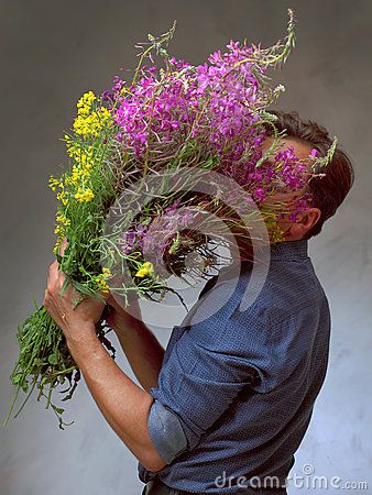 Man holding a huge bouquet of wildflowers Person Holding Bouquet, Man Holding Bouquet, Huge Bouquet, Bouquet Of Wildflowers, Holding Bouquet, Pose References, Reference Pictures, Poses Reference, Flower Photography