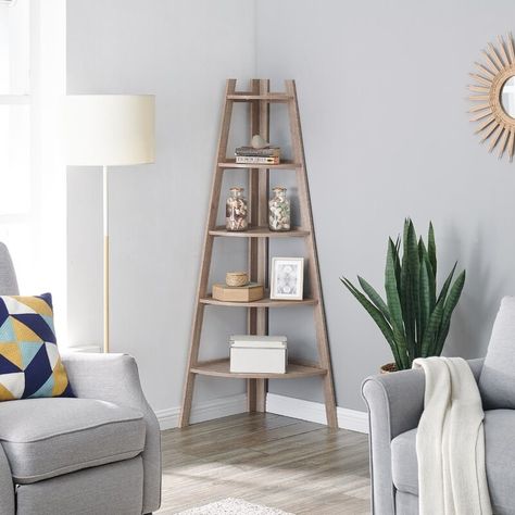 A corner bookcase, so even the smallest apartments can get some extra stylish storage space. Corner Ladder Shelf, Ladder Display, Furnitur Ruang Keluarga, Decorative Shelving, Corner Bookshelves, Corner Space, Shelf Bookcase, Ladder Shelf, Corner House