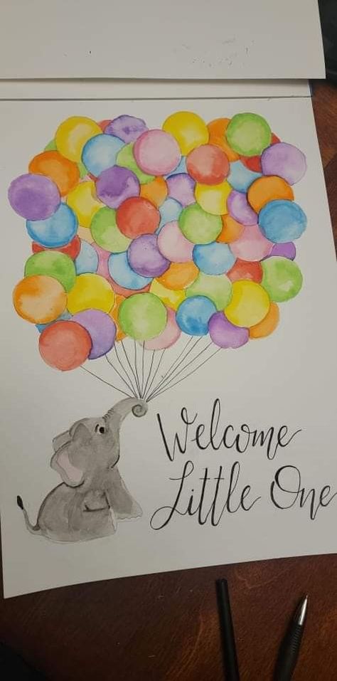 A watercolor painting done on white paper, of an elephant sitting in the bottom left corner, using its trunk to hold a large group of balloons. The balloons are each a different color of the rainbow. Several balloons are full, visible circles, intended for baby shower guests to sign their name. In the bottom right corner, in handwritten script, are the words "Welcome Little One." Newborn Painting Ideas Canvases, Baby Boy Painting Ideas, Baby Girl Painting Ideas, Baby Canvas Ideas, Baby Painting Ideas Canvases, Baby Shower Painting Ideas, Painting For Baby Girl, Nursery Paintings Canvas, Baby Canvas Painting