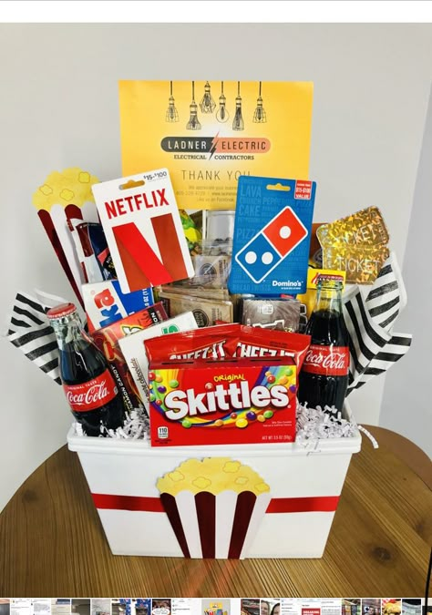 Gift Baskets Ideas For Raffles, Movies Basket Ideas, Movie Themed Basket Ideas, What To Put In A Movie Night Gift Basket, Movie Night Prize Basket, Bingo Night Prizes Gift Ideas, Entertainment Basket Ideas, Popcorn Raffle Basket Ideas, Themed Silent Auction Baskets