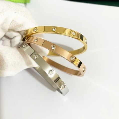 Embrace the elegance of the 2024 new design with the Gold Color Zircon and Cross Nut Nail Bracelet. This stunning piece combines the luxury of zircon with the modernity of the cross and screw design, creating a unique and sophisticated piece of jewellery. Made from high-quality stainless steel with a gold finish, this bracelet offers durability and stylish elegance, making it the perfect accessory for any occasion. Whether for a special event or to add a touch of glamour to your everyday look... Nail Bracelet, Jewelry Photography, The Gold, The Cross, News Design, Special Event, New Design, Gold Finish, Everyday Look