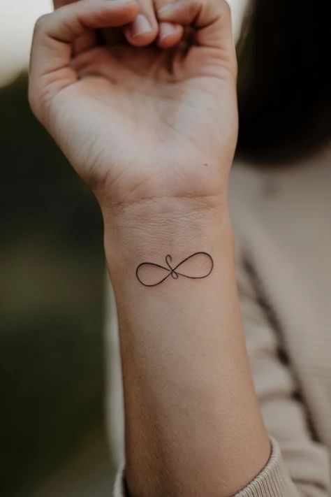 Infinity symbol tattoo on a person's wrist. Heart And Infinity Tattoo, Trust Symbol, Infinity Sign Tattoo, Tattoo Ideas For Females, Infinity Tattoo On Wrist, Infinity Symbol Tattoo, Meaningful Tattoo Ideas, Unique Tattoo Ideas, Symbol Tattoo