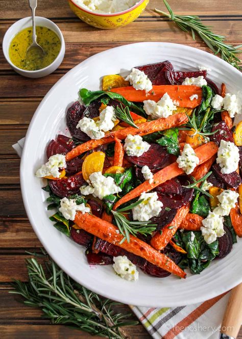 Roasted beets and carrots with sautéed beet greens tossed with honey rosemary vinaigrette and topped with burrata. A perfect fall vegetable side dish. Fall Vegetable Side Dishes, Beet And Carrot Salad, Beetroot And Carrot Salad, Salad Panzanella, Sauteed Beet Greens, Beets And Carrots, Roasted Carrot Salad, Roasted Beets And Carrots, Tomatoes Recipes