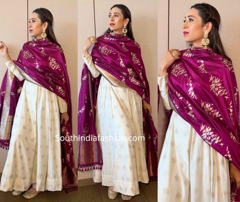 Karisma Kapoor attended an event in Kolkata wearing an off-white anarkali suit with purple banarasi dupatta by Ekaya Banaras. Jewelry from Azotiique and Fizzy Goblet juttis complemented her look! White Anarkali With Banarasi Dupatta, White Banarasi Suit, White Salwar Suit Party Wear, White Anarkali Dress With Red Dupatta, Banarasi Dupatta Suits Party Wear, Banarasi Anarkali Suits, Off White Anarkali Suits, Anarkali With Banarasi Dupatta, Banarasi Dupatta Suits