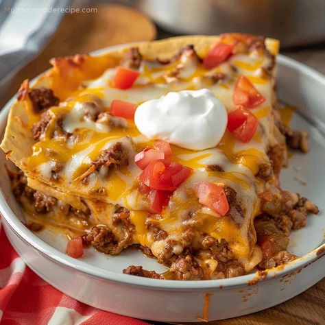 This Taco Casserole with Tortillas features layers of seasoned beef, creamy salsa con queso, and melted cheese for a hearty and flavorful meal. Texas Casserole Recipes, Casserole Using Corn Tortillas, Tortilla Stack Recipe, Recipes With Soft Tortilla Shells, Tortilla Ground Beef Recipes, Tortilla Casserole Recipes Beef, Taco Bake Casserole With Tortillas, Tortilla Taco Casserole, Taco Pie With Tortillas