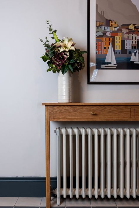 Devlin & Co's Radiator & Console tables are bespoke creations, customisable to your requirements, you can change the length, height and depth to suit your space, have it painted any colour you want or add drawers and knobs. PRODUCT DESCRIPTION Our elegant solid oak table allows you to create a beautiful focal point in a narrow hallway by disguising your radiator, It's a great alternative to traditional radiator covers as all the heat can escape into the space.  DRAWERS tables come with faux drawers but working drawes can be added for an additional costs. We can also source knobs to suit your need. The knobs in the photos ard from Corston. HOW TO MEASURE We recommend you choose a table 20cm wider than the width of your radiator, at least 10cm higher than your radiator and a minimum 10cm fro