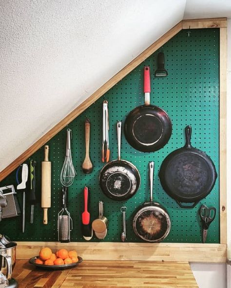 green pegboard on a small wall filled with pans and cooking utensils Small Cabin Organization Ideas, Diy Kitchen Storage Ideas For Small Spaces, Small Kitchen Pots And Pans Storage, Diy Small Apartment Ideas, Colorful Small Kitchen, Diy Kitchenette Small Spaces, Small Kitchen Ideas Color, How To Organize A Small Kitchen, Wall Kitchen Organization