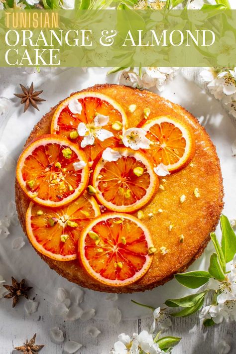 Tunisian cake with sliced oranges on top, surrounded by blossoms. Resep Vegan, Orange And Almond Cake, Orange Cream Cheese, Cream Cheese Pound Cake, Cake Photography, Almond Cake, Orange Cake, Star Anise, Orange Recipes