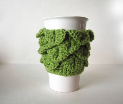 Dragon Scale Cup Cozy in Light Green - Crochet Coffee Sleeve Perfect to keep your drinks warm and your hands protected. This beautiful Dragon Scale cozy makes a lovely gift! This handmade coffee sleeve is reusable and eco-friendly. Great for hot or cold drinks. Fits most standard to-go cups. Check out my other cup cozies https://www.etsy.com/ca/shop/MadebyJody666?section_id=17119190&ref=shopsection_leftnav_2 Crochet Cup Holder, Cactus Cup, Jennifer Wood, Crochet Coffee, Crochet Cactus, Handmade Plushies, Crochet Dragon, Mug Warmer, Mug Cozy