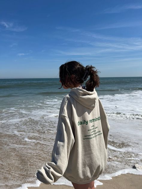 @jackie.carson styling our "Daily Reminders" hoodie 🌤 Enjoying a perfect spring day by the beach 🌊🏝🐚 Beach Hoodie Aesthetic, Sweatshirt On The Beach, Beach Hoodie Pictures, Girl In Hoodie Aesthetic, Charity Shop Finds, Beach Hoodie, Hoodie Aesthetic, Daily Reminders