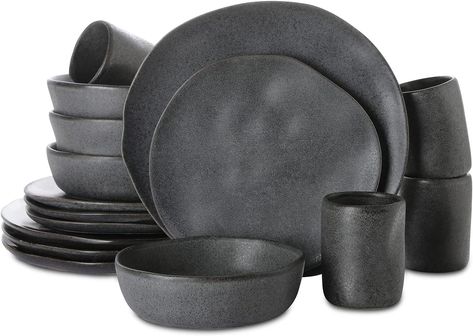 Stone by Mercer Project HEKONDA Debossed Stoneware 16-Piece Dinnerware Set, Gray SERVICE FOR 4 - Beautify your table setting with this organic round shape and textured dinnerware set. The stoneware set service for 4 includes salad plates (8.8-inch), dinner plates (11-inch), bowls (20 fl.oz) and cups (10 fl.oz). UNIQUE ARTISTIC PIECE - The organic shapes, tactile cues, and hand carved inspirational notes are all evidence of human touch, and illustrate the artistic process. Grey Dinnerware Bed Bath & Beyond, Stone Dishes Plates, West Elm Organic Dinnerware, Rustic Dinnerware Sets Stone, Organic Dinnerware Sets, Cheap Plates Sets, Modern Plates Set Dinnerware Stone, Matte Plate Set, Modern Plates Set Dinnerware Crate And Barrel