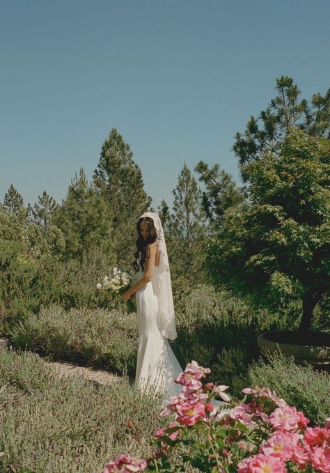 This mantilla embodies poetic romance. Crafted from ethereal floral-embroidered lace, it cascades with the grace of a love sonnet, delicately framed by French alencon lace. With its vintage-inspired design, it is a love story spun in lace, destined to drape over your head with grace. • A classic 42'' fingertip length bridal veil that is hand sewn from the most luxurious all-over floral embroidery• The edge of the veil is trimmed with a customizable scalloped lace• In white, off white, light ivory, or ivory• A discreet silver, rose gold, or gold metal hair comb is sewn to the underside for easy and secure placement CONSTANCY: steadfast and loyal Can't decide which color you need? Order free samples of tulle and lace HERE. Bridal Hair With Mantilla Veil, Mantilla Veil Short Hair, Traditional Veils Bridal, Lace Wedding Dress And Veil, 70s Wedding Veil, Short Lace Veil, Christian Wedding Veil, Vintage Lace Wedding Veil, Wedding Veil Hair Down