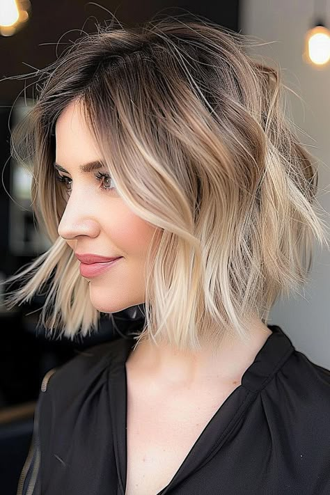 Woman with a short textured bob and champagne blonde hair Lived In Blonde Balayage Bob, Chin Length Bob Balayage, Short Balayage Bob, Brunette To Blonde Bob, Root Smudge Bob, Warm Blonde Balayage Short Hair, Short Ombre Hair Brown To Blonde, Balayage Bob Blonde, Bob Balayage Hair