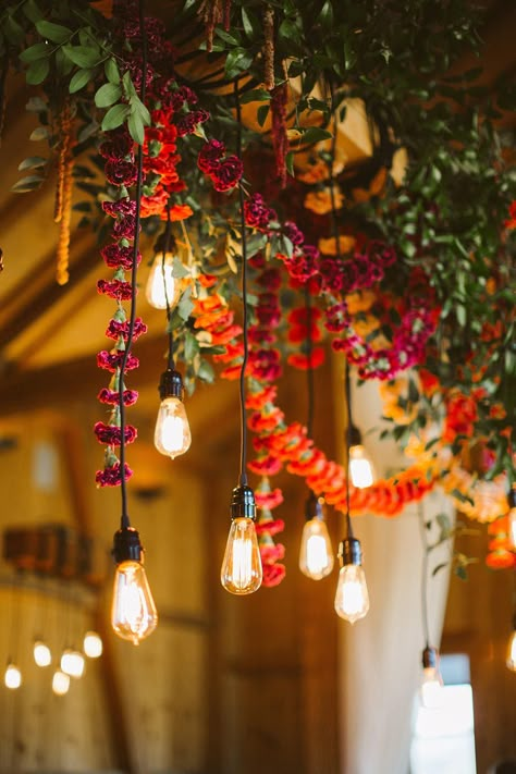 edison bulb wedding lighting Eclectic Bohemian Wedding, Colorful Woodland Wedding, Rustic Jewel Tone Wedding, Eclectic Wedding Aesthetic, Eclectic Western Wedding, Vibrant Fall Wedding Colors, Jewel Wedding Theme, Jewel Tone Party, Fall Eclectic Wedding